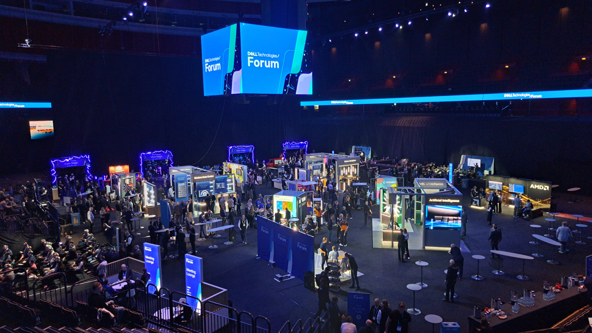The Dell Technologies Forum exhibition floor with the suspended cube screen and attendee walkways